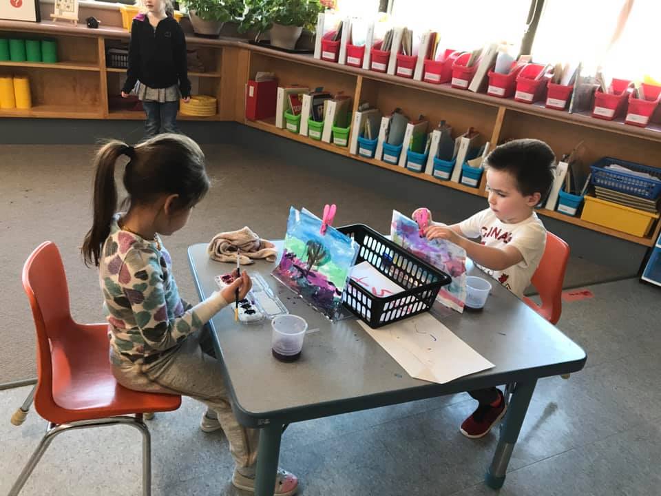 Children Creating Artwork at table